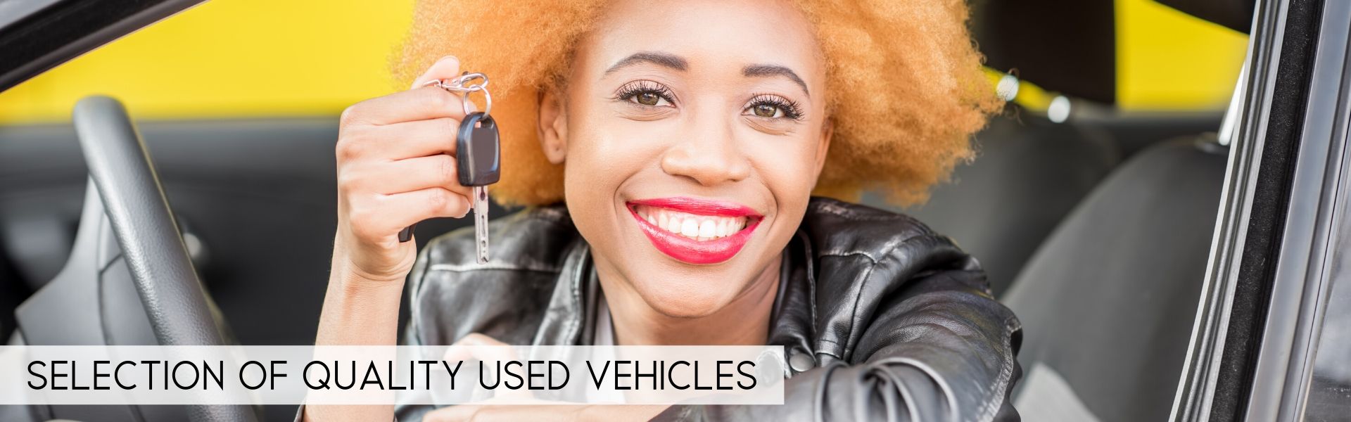 happy lady holding a new car key of a pre-owned vehicle in Pretoria South Africa legacy motor group pre-owned image 3