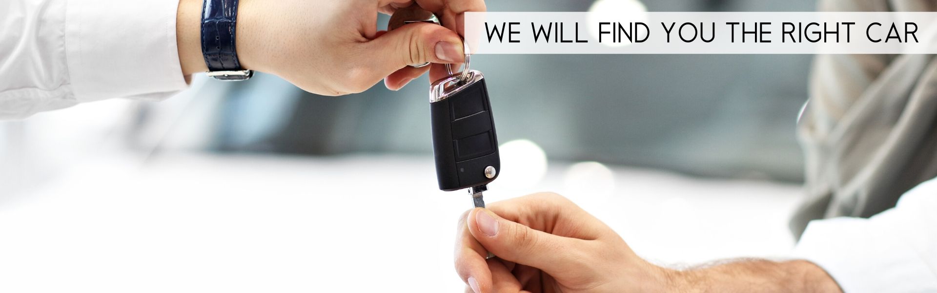 handing over a car key to the customer legacy motor group pre-owned image 2